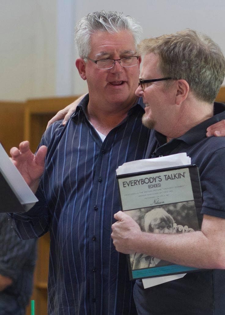 Gregory Jbara and Steve Gunderson share a laugh in rehearsal; one holds a binder of Everybody's Talkin' sheet music.